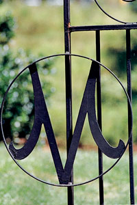 Metal gate with Meredith M letter in it.
